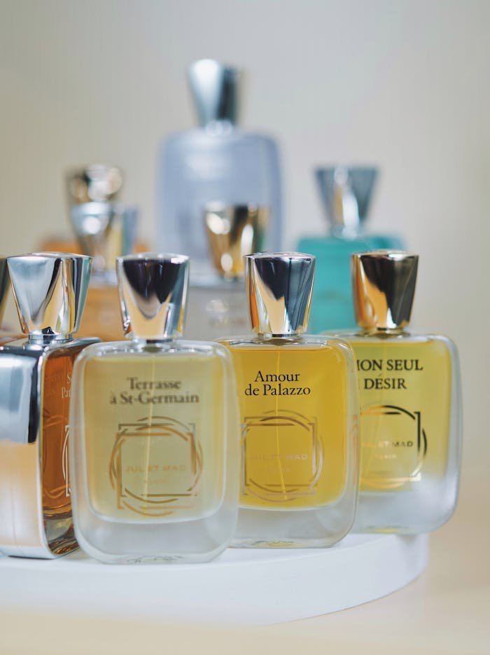 Close-up of premium glass perfume bottles with elegant designs. Perfect for fragrance branding and luxury marketing.